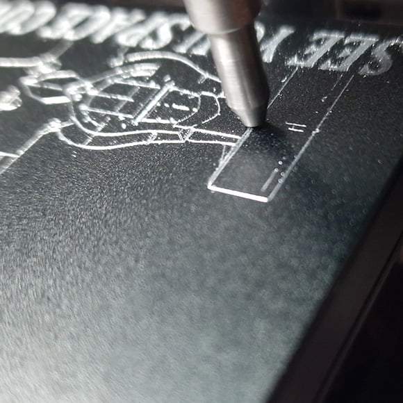 RFID Metal Pop Wallet in Black being Engraved